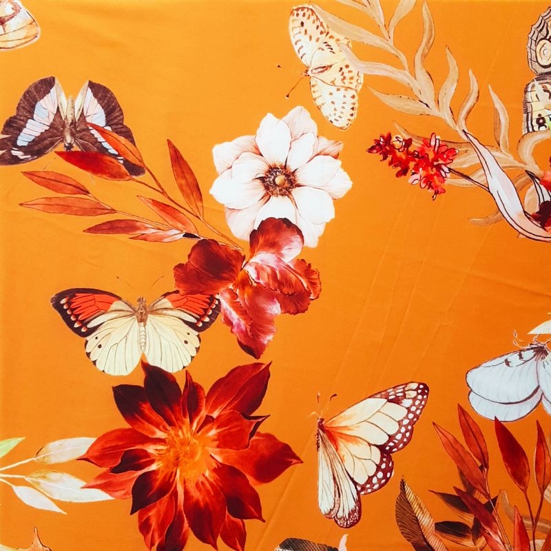 Wikkelblouse kort met band en ballonmouwen oker met bloem print en vlinders. Laatste stuks!
